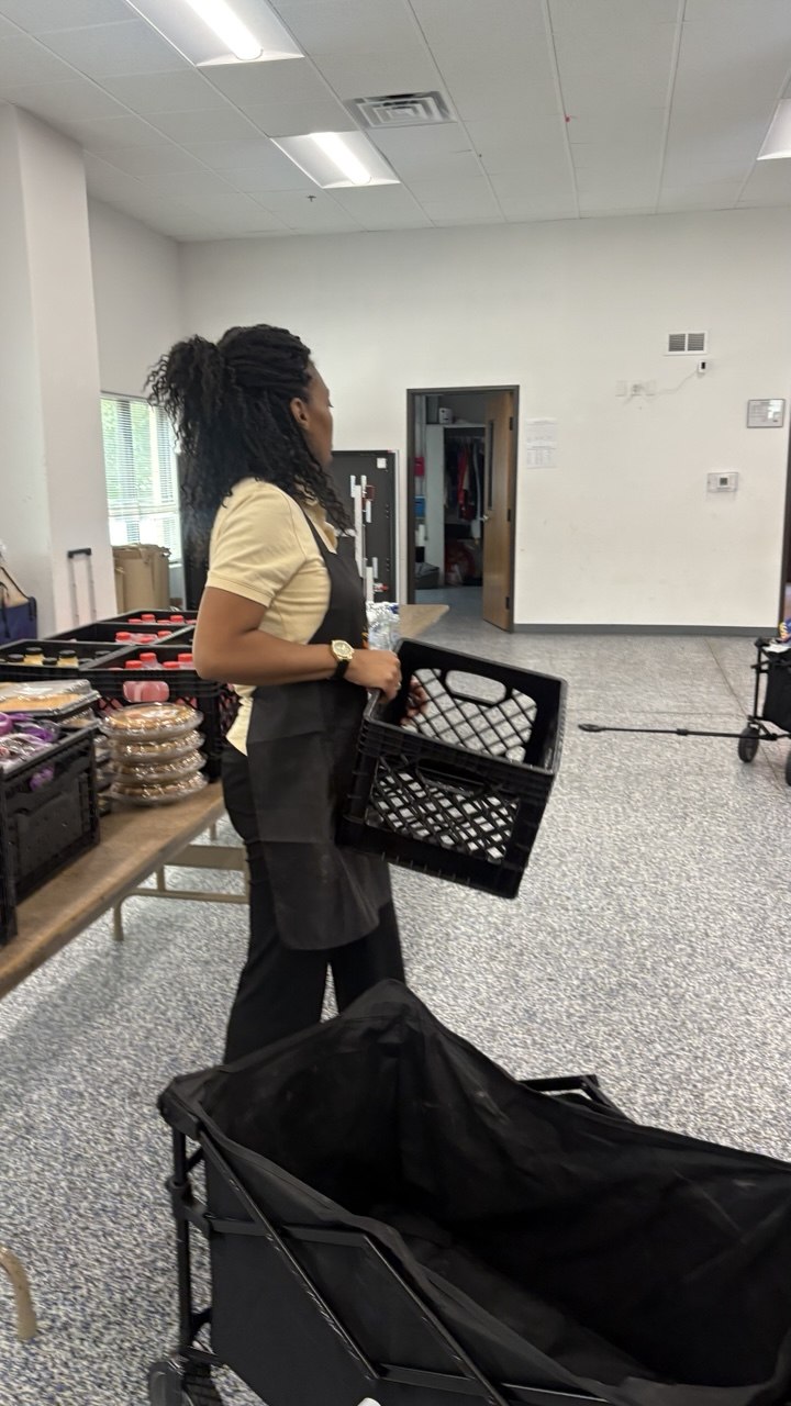 Volunteer with crate